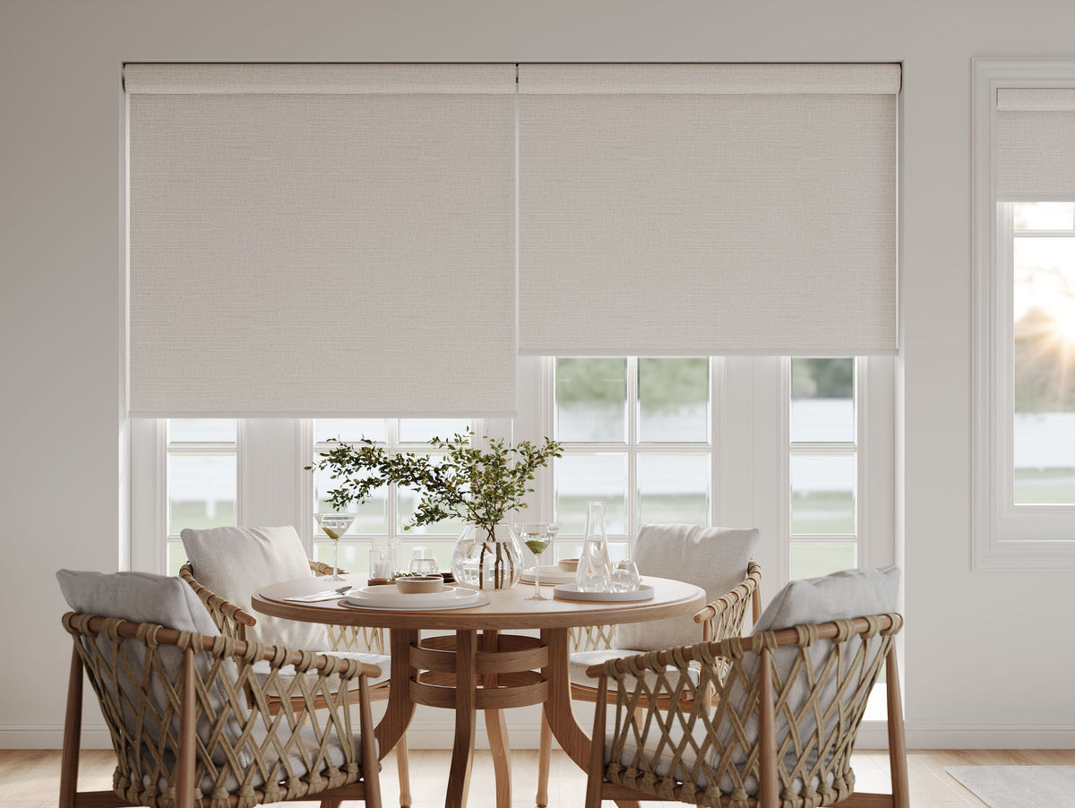 Roller shades at different positions in a dining room