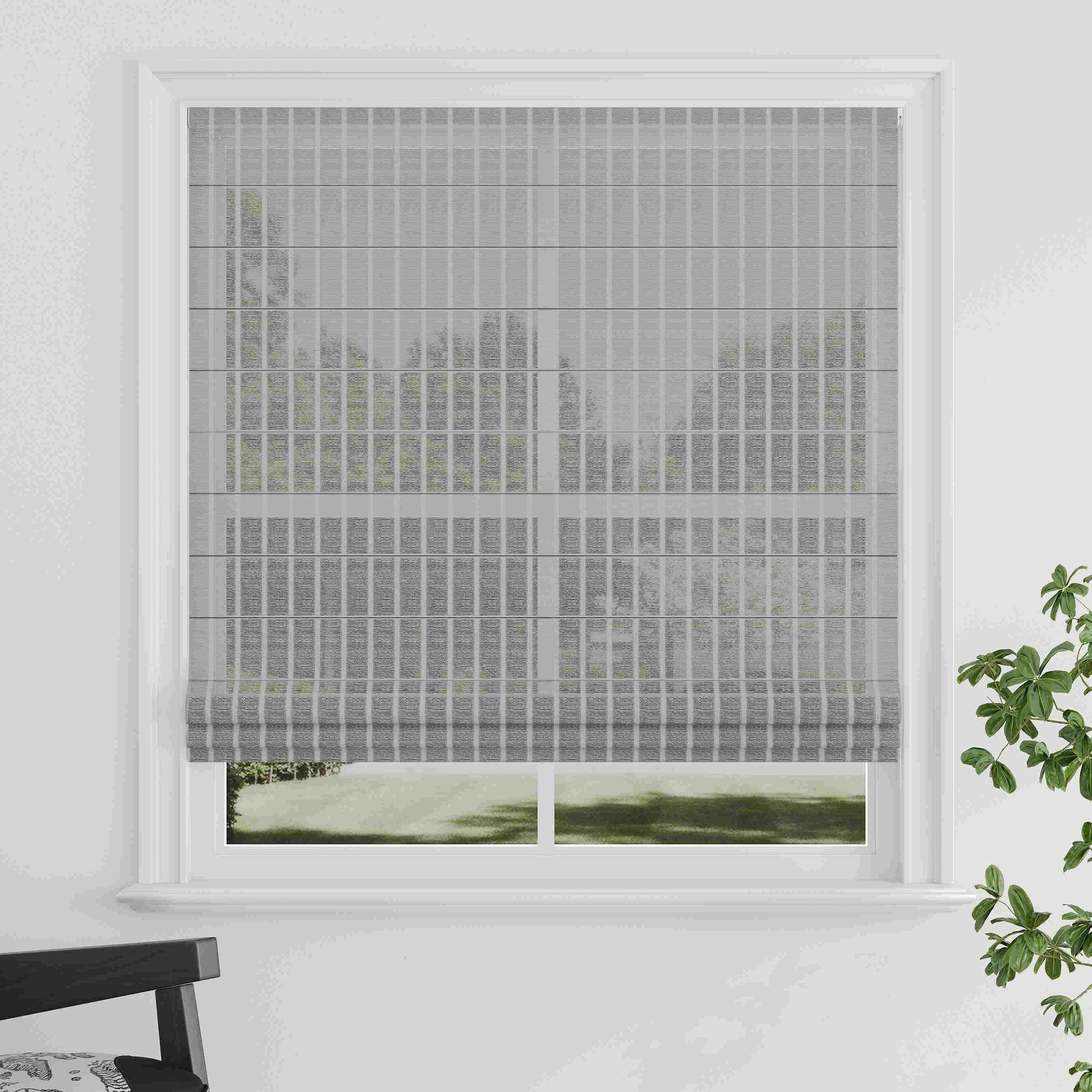 Close-up of textured light beige roller blind fabric sample.