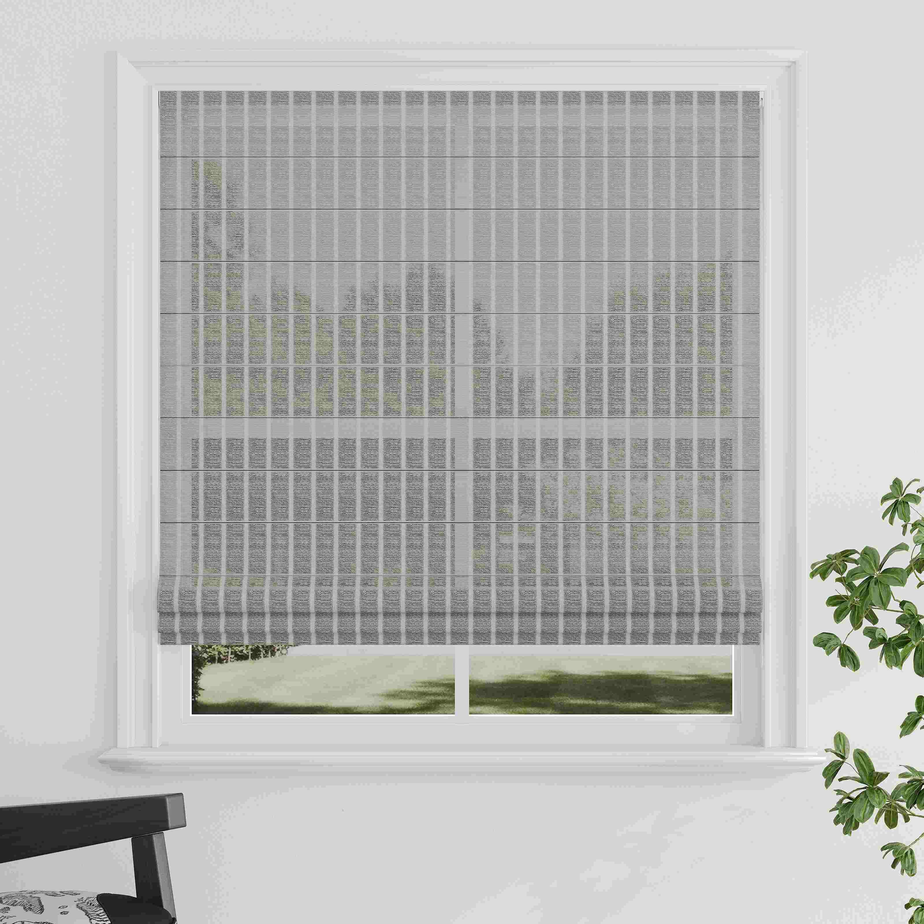 Close-up of layered window blinds with alternating sheer and opaque fabric