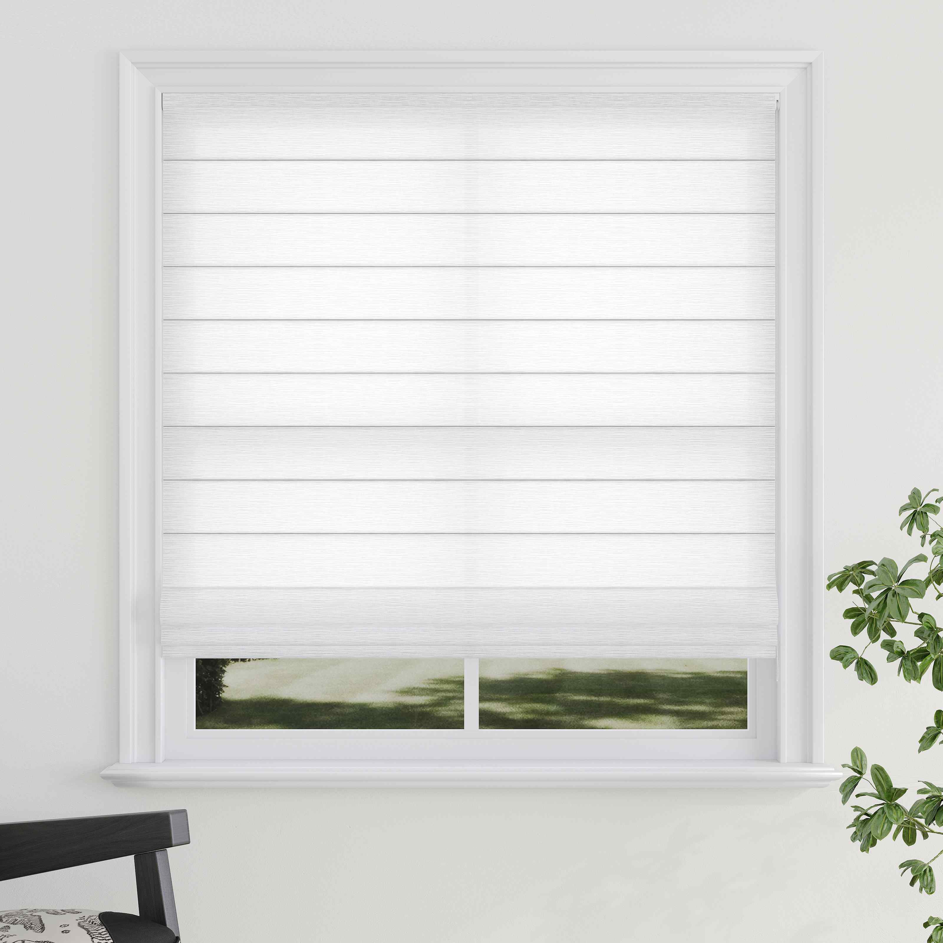 A white Roman shade with a textured pattern, raised weave texture, installed in a window with a view of greenery outside. A chair with a striped pattern is partially visible to the left.